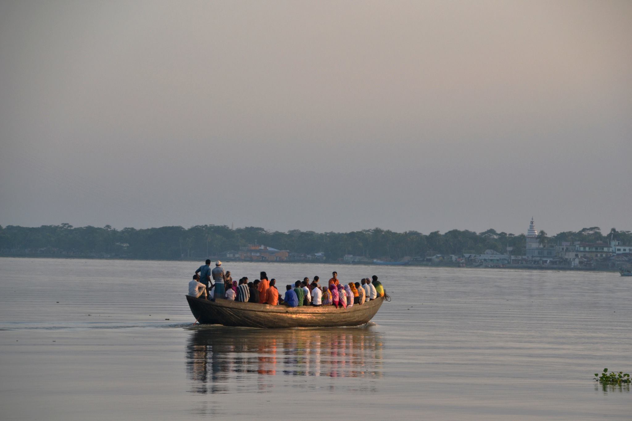 People crossing a river in Bangladesh - Credit: Sonja Ayeb-Karlsson