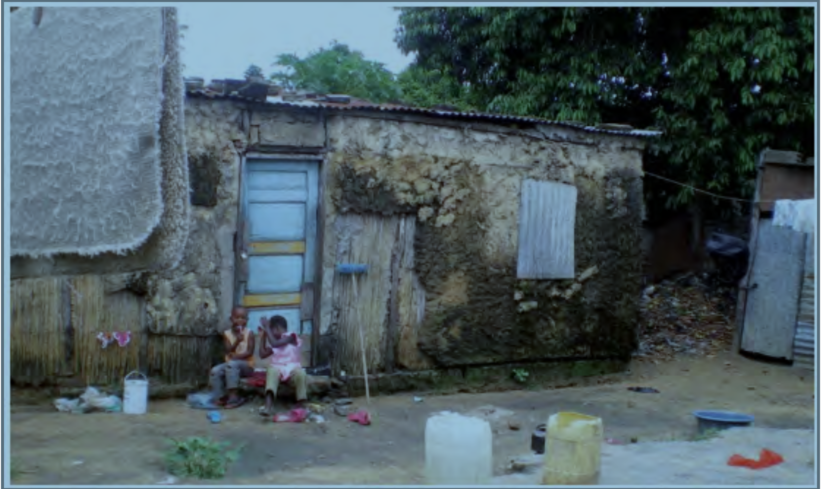 Two children play around a household in Chamanculo C., Maputo. Photo provided by: Charlotte Allen